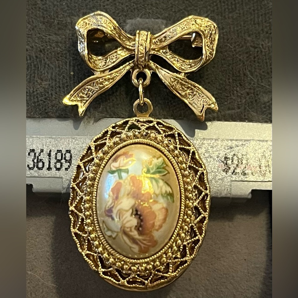 1928 Gold Tone Bow Locket Brooch with Floral Center